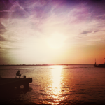 Fishing on the pier at sunset